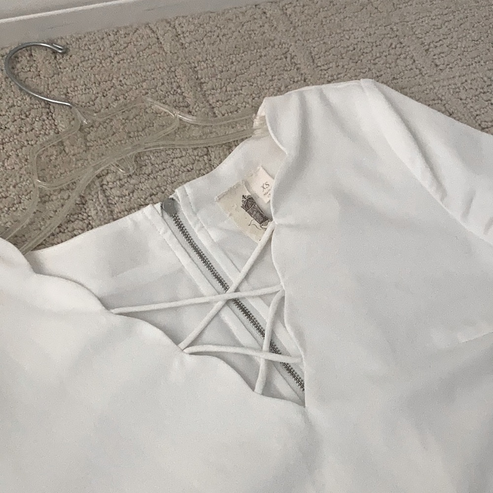 An XS sundress, about knee length. Never been worn before:)